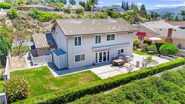 6421 Acacia Hill Dr, Yorba Linda, CA 92886 - back of property featuring a patio, a tiled roof, stucco siding, french doors, and a residential view