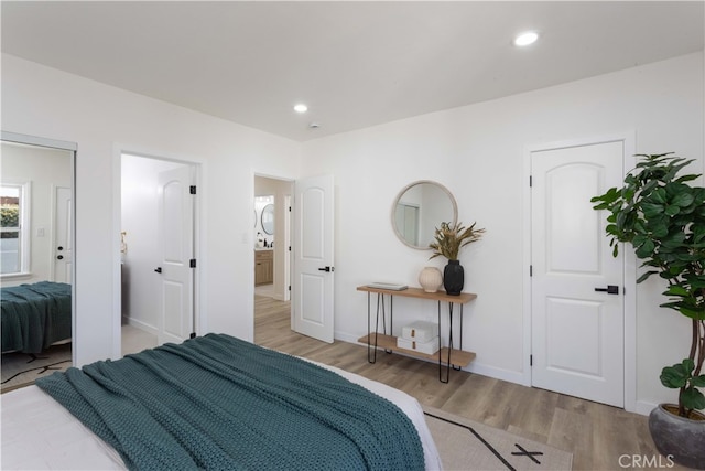 1116 W 80th St, Los Angeles, CA 90044 - bedroom featuring wood finished floors, recessed lighting, and baseboards