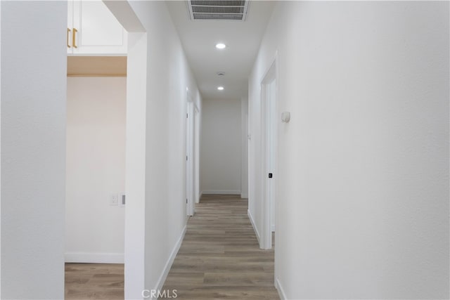 1116 W 80th St, Los Angeles, CA 90044 - hall with light wood-type flooring, baseboards, and recessed lighting