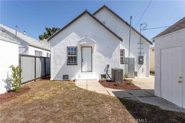 1116 W 80th St, Los Angeles, CA 90044 - rear view of house with stucco siding and central AC unit