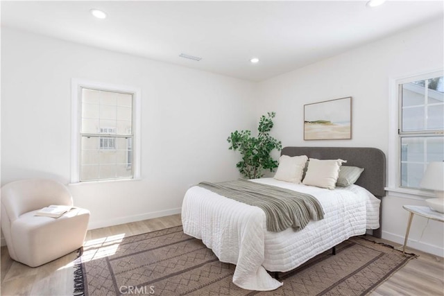 1116 W 80th St, Los Angeles, CA 90044 - bedroom featuring wood finished floors, recessed lighting, and baseboards