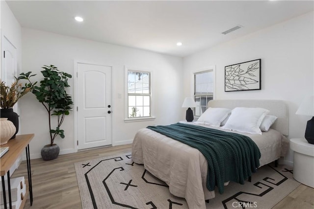 1116 W 80th St, Los Angeles, CA 90044 - bedroom featuring light wood-style flooring, recessed lighting, and baseboards