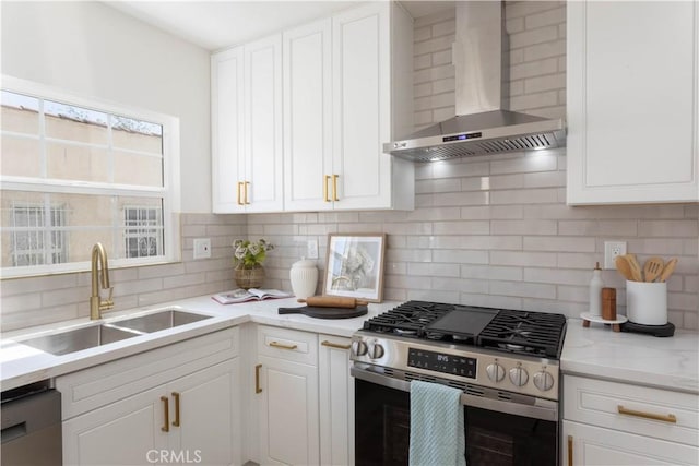 1116 W 80th St, Los Angeles, CA 90044 - kitchen featuring appliances with stainless steel finishes, wall chimney exhaust hood, a sink, backsplash, and white cabinetry