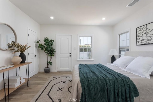1116 W 80th St, Los Angeles, CA 90044 - bedroom featuring light wood finished floors, recessed lighting, and baseboards