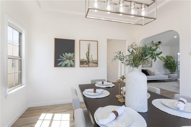 1116 W 80th St, Los Angeles, CA 90044 - dining room featuring light wood finished floors, healthy amount of natural light, and baseboards