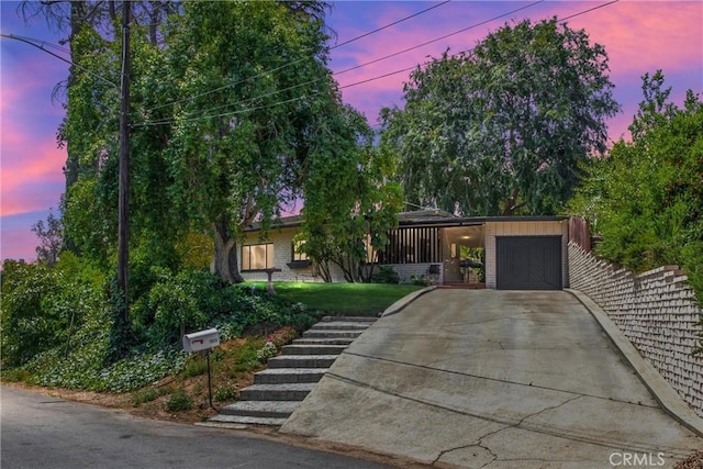 1872 Arroyo Dr, Riverside, CA 92506 - view of front of house with driveway, an attached garage, and stairway