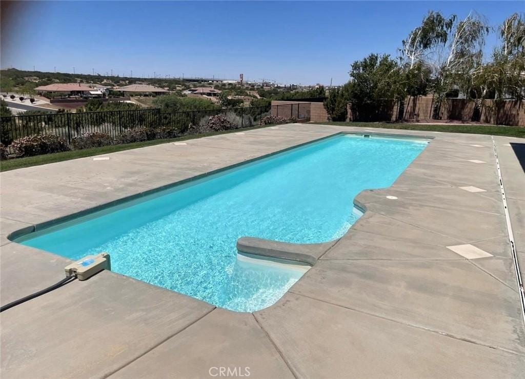 6940 Oak Vista Ln, Oak Hills, CA 92344 - view of pool with a patio area and a fenced backyard