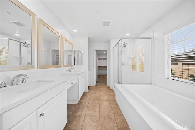 11877 Crossbill Way, Jurupa Valley, CA 91752 - bathroom featuring a stall shower, a spacious closet, double vanity, a garden tub, and recessed lighting