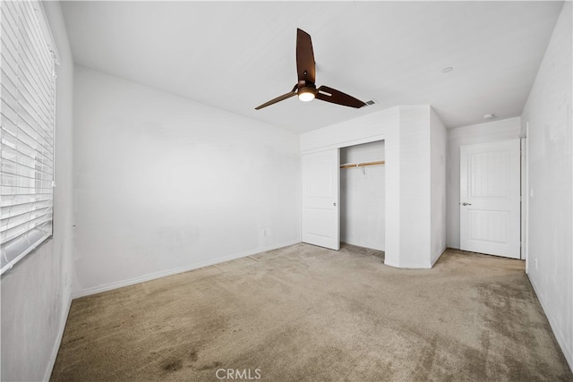 11877 Crossbill Way, Jurupa Valley, CA 91752 - unfurnished bedroom with carpet, a closet, a ceiling fan, and baseboards