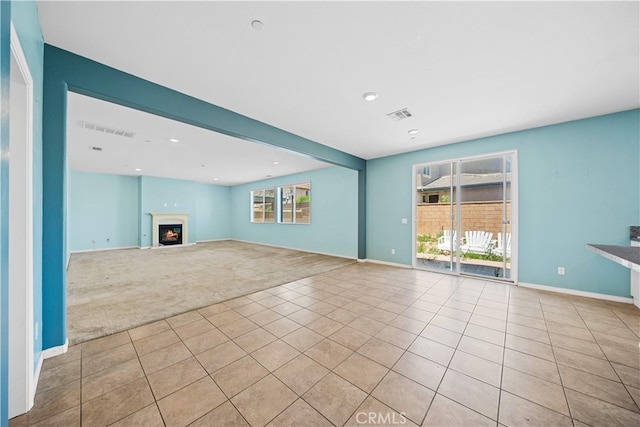 11877 Crossbill Way, Jurupa Valley, CA 91752 - unfurnished living room featuring carpet flooring, tile patterned flooring, baseboards, and recessed lighting