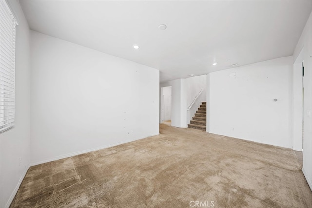 11877 Crossbill Way, Jurupa Valley, CA 91752 - unfurnished room with light carpet, recessed lighting, and stairway