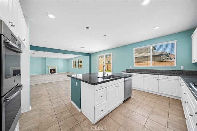 11877 Crossbill Way, Jurupa Valley, CA 91752 - kitchen featuring a sink, stainless steel appliances, light tile patterned floors, a kitchen island, and recessed lighting