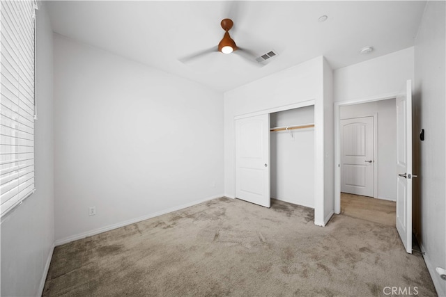 11877 Crossbill Way, Jurupa Valley, CA 91752 - unfurnished bedroom with carpet floors, a closet, ceiling fan, and baseboards