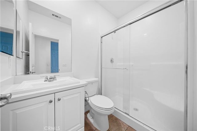 11877 Crossbill Way, Jurupa Valley, CA 91752 - bathroom featuring a shower stall, toilet, vanity, and tile patterned flooring