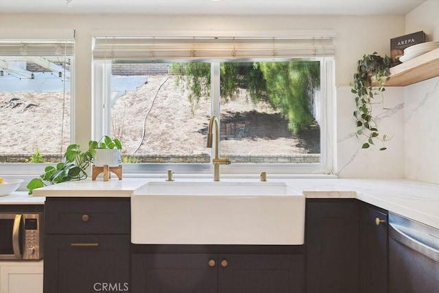 27721 Wakefield Rd, Castaic, CA 91384 - kitchen featuring a sink, appliances with stainless steel finishes, light countertops, and dark brown cabinetry