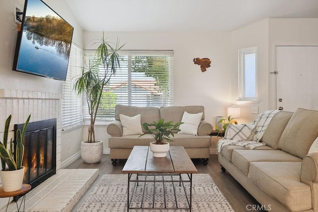 27721 Wakefield Rd, Castaic, CA 91384 - living room with wood finished floors, baseboards, and a fireplace