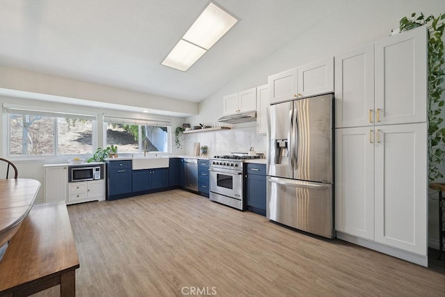 27721 Wakefield Rd, Castaic, CA 91384 - kitchen featuring appliances with stainless steel finishes, blue cabinets, open shelves, vaulted ceiling, and light wood-type flooring