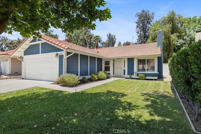 27721 Wakefield Rd, Castaic, CA 91384 - ranch-style house with a tiled roof, an attached garage, and a front lawn
