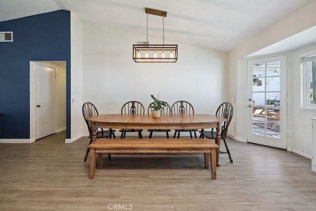 27721 Wakefield Rd, Castaic, CA 91384 - dining room with vaulted ceiling, light wood finished floors, and baseboards