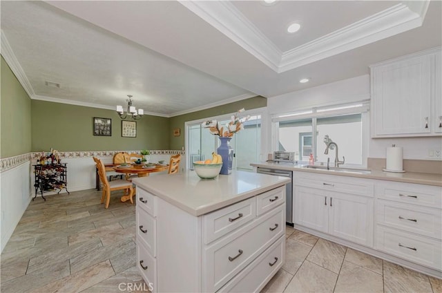 5526 Donner Ave, Buena Park, CA 90621 - kitchen featuring stainless steel dishwasher, a sink, ornamental molding, a chandelier, and light countertops