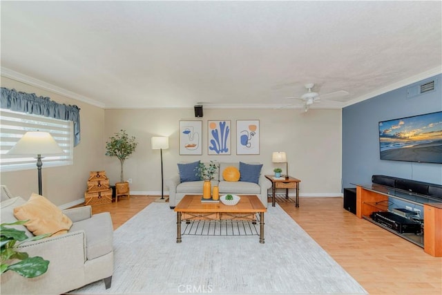 5526 Donner Ave, Buena Park, CA 90621 - living room featuring crown molding, light wood-type flooring, a ceiling fan, and baseboards