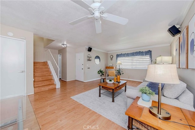 5526 Donner Ave, Buena Park, CA 90621 - living room with stairs, ceiling fan, wood finished floors, crown molding, and baseboards