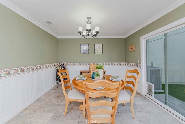 5526 Donner Ave, Buena Park, CA 90621 - dining area featuring a chandelier, crown molding, and a wainscoted wall