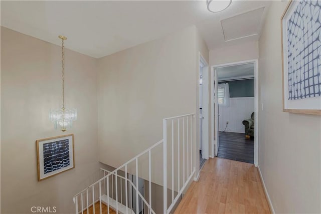 5526 Donner Ave, Buena Park, CA 90621 - hallway with an upstairs landing, wood finished floors, and baseboards