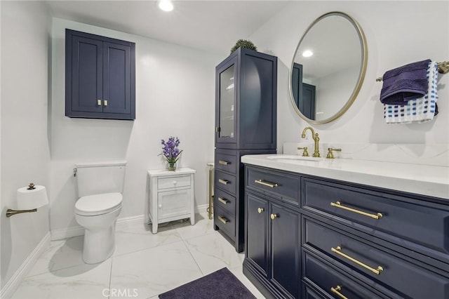 11218 Camarillo St Unit 305, Toluca Lake, CA 91602 - bathroom featuring marble finish flooring, toilet, vanity, baseboards, and recessed lighting