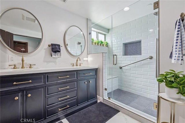 11218 Camarillo St Unit 305, Toluca Lake, CA 91602 - full bathroom with double vanity, a shower stall, and marble finish flooring