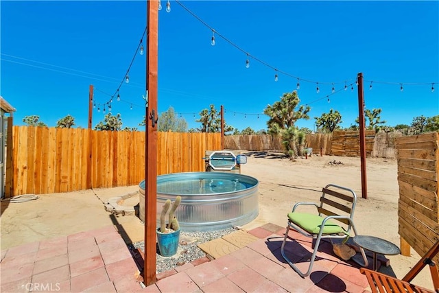 57620 Buena Vista Dr, Yucca Valley, CA 92284 - fenced backyard featuring an outdoor hot tub and a patio