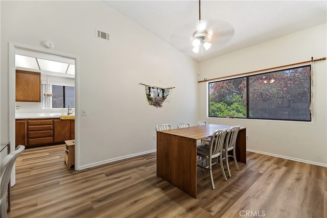 819 Shade Tree Ln, Fallbrook, CA 92028 - office area featuring lofted ceiling, a ceiling fan, wood finished floors, baseboards, and a sink