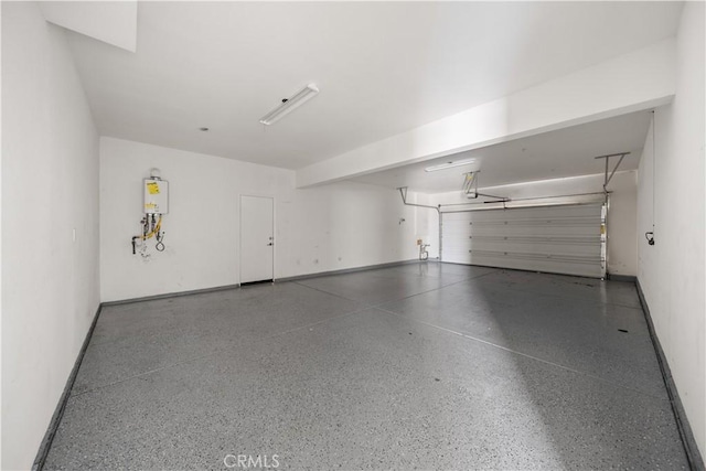 11836 Crossbill Way, Jurupa Valley, CA 91752 - garage featuring water heater and baseboards