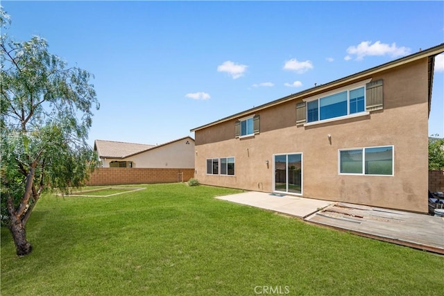 11836 Crossbill Way, Jurupa Valley, CA 91752 - rear view of property with stucco siding and a patio
