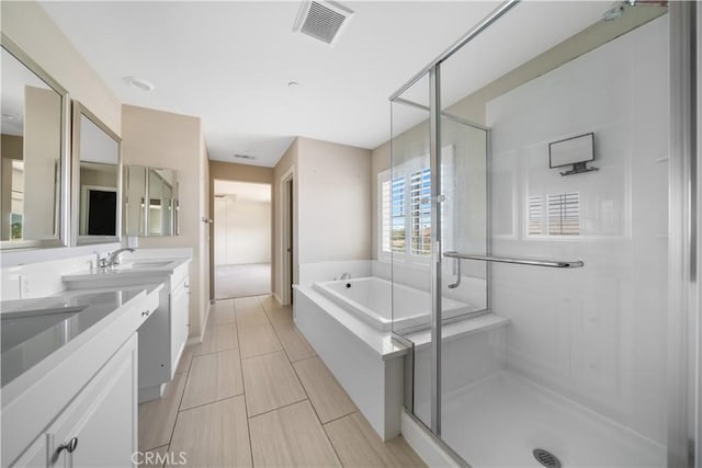 11836 Crossbill Way, Jurupa Valley, CA 91752 - bathroom with double vanity, a garden tub, and a stall shower