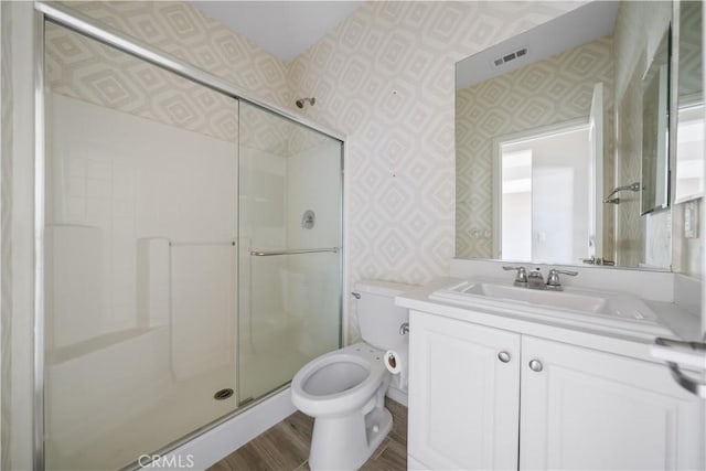 11836 Crossbill Way, Jurupa Valley, CA 91752 - full bath featuring wallpapered walls, vanity, toilet, and a stall shower
