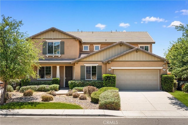 11836 Crossbill Way, Jurupa Valley, CA 91752 - view of front of home featuring a tile roof, a garage, driveway, and stucco siding