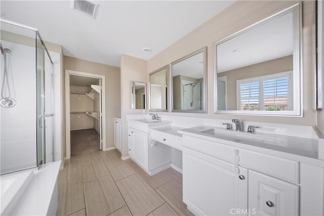 11836 Crossbill Way, Jurupa Valley, CA 91752 - bathroom with a shower stall, double vanity, a spacious closet, and a bathtub