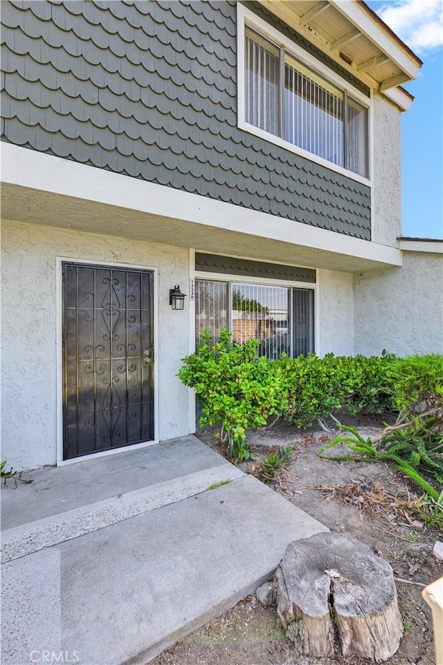 13338 Woodbrook Cir, Garden Grove, CA 92844 - view of exterior entry with stucco siding