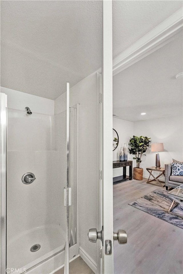 13338 Woodbrook Cir, Garden Grove, CA 92844 - bathroom featuring a stall shower and wood finished floors