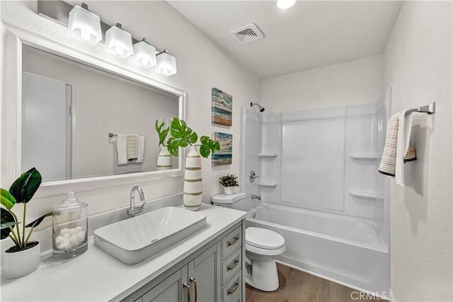 13338 Woodbrook Cir, Garden Grove, CA 92844 - full bath with toilet, vanity, shower / tub combination, and wood finished floors
