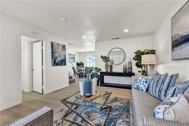 13338 Woodbrook Cir, Garden Grove, CA 92844 - living room featuring light wood-style flooring, stairs, baseboards, and recessed lighting