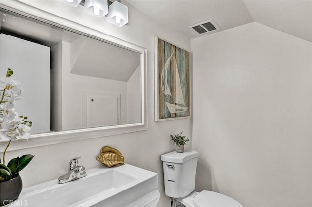 13338 Woodbrook Cir, Garden Grove, CA 92844 - bathroom featuring toilet, vanity, and vaulted ceiling