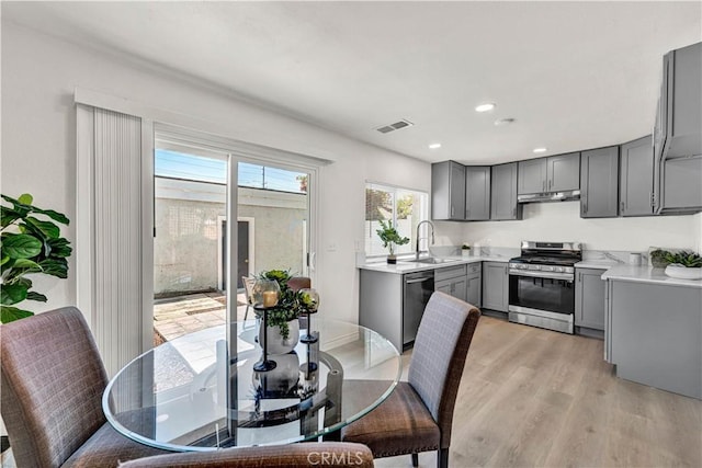 13338 Woodbrook Cir, Garden Grove, CA 92844 - dining room with light wood-style floors and recessed lighting