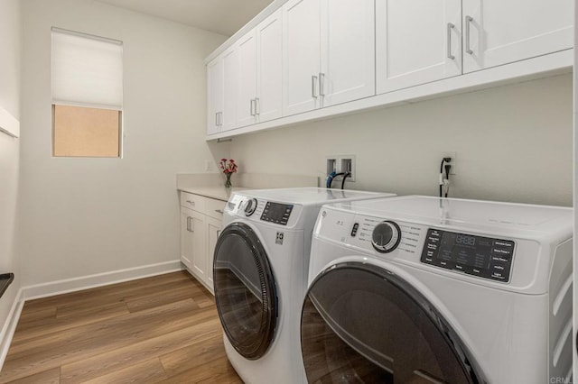 675 Westbrook Loop, San Marcos, CA 92078 - laundry area with washing machine and dryer, cabinet space, light wood finished floors, and baseboards