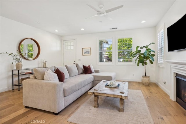 3207 Daisy Ln, San Luis Obispo, CA 93401 - living area with light wood-style flooring, a glass covered fireplace, baseboards, recessed lighting, and ceiling fan