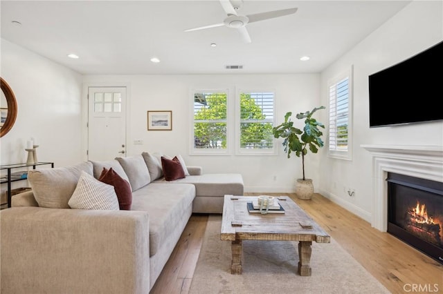 3207 Daisy Ln, San Luis Obispo, CA 93401 - living room featuring wood finished floors, recessed lighting, a glass covered fireplace, baseboards, and a ceiling fan