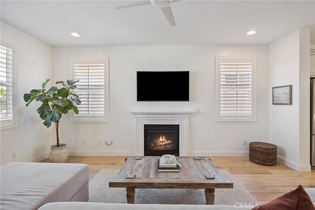 3207 Daisy Ln, San Luis Obispo, CA 93401 - living area with wood finished floors, a glass covered fireplace, ceiling fan, baseboards, and recessed lighting