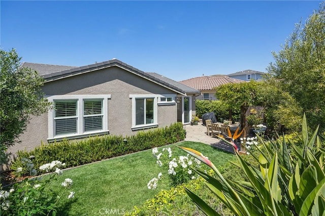 3207 Daisy Ln, San Luis Obispo, CA 93401 - back of property featuring a patio, a yard, and stucco siding