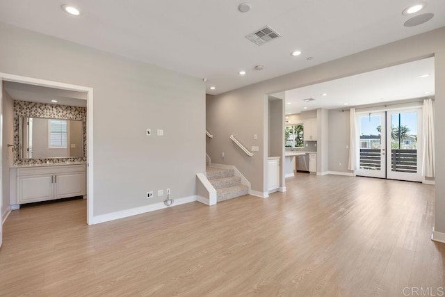 1105 Hibiscus Way, Oceanside, CA 92054 - empty room featuring light wood-style floors, recessed lighting, stairway, and baseboards